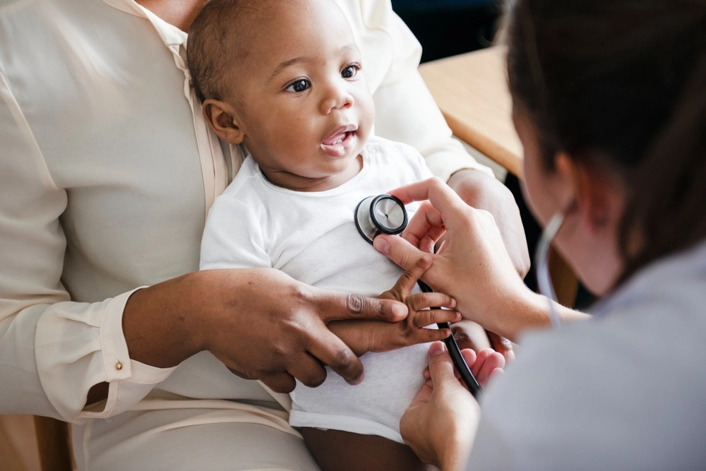 Baby being examined by a medical professional, illustrating birth injuries affecting families across Texas.